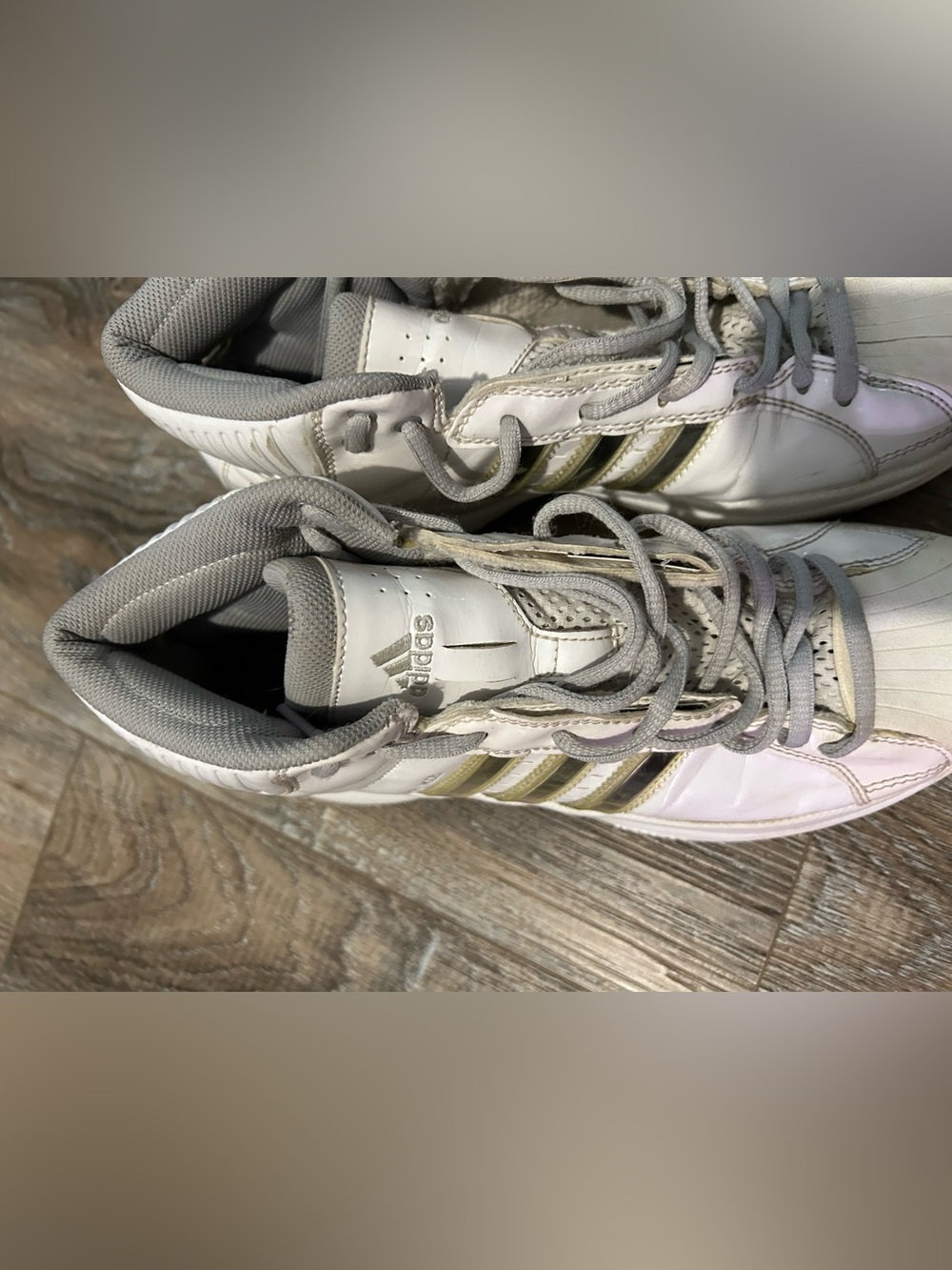 adidas White Athletic Shoes with Gold Accent Stripes